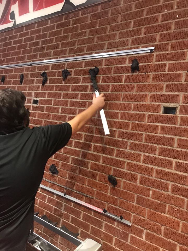 Process of Installing a Wall of Mirrors at the gym. 