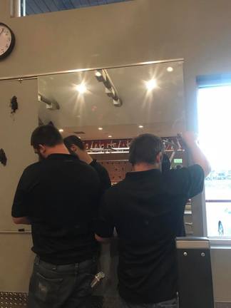 Process of Installing a Wall of Mirrors at the gym. 